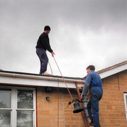 Graham and Sam Clifton hosing it into the present school. Clapper donated by Whites of Appleton. Rope donated by Gardner family. Fund raising by school children, Work carried out by Clifton family. 1995