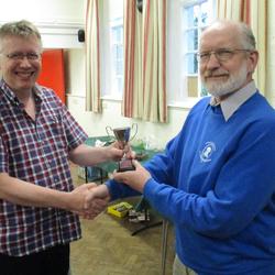 Jon McLoone receives the winners cup after Steeple Aston win the 2022 changes striking competition in Horley