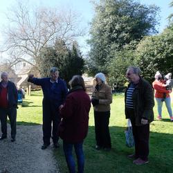 Graham Clifton explaining the new bell to onlookers