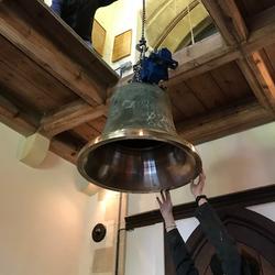 Raising the bell to the ringing platform.